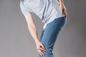 Are you experiencing any of the following symptoms? Pain on the outside of the knee or hip Snapping hip pain associated with movement Pain that generally disappears as the leg is stretched and flexibility increases Pain in the hip that improves with rest The iliotibial band is composed of fibrous tissue that provides stability to the knee and hip and prevents dislocation. In this condition, the band may overdevelop, tighten, and rub across the hipbone or the outer part of the knee when bent or flexed. This condition can arise from repeated aerobic activity, and is particularly common in runners and cyclists.