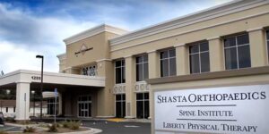Shasta Orthopaedics. Photo of the front entrance and 2-story building for Redding orthopaedics center, Shasta Orthopaedics.